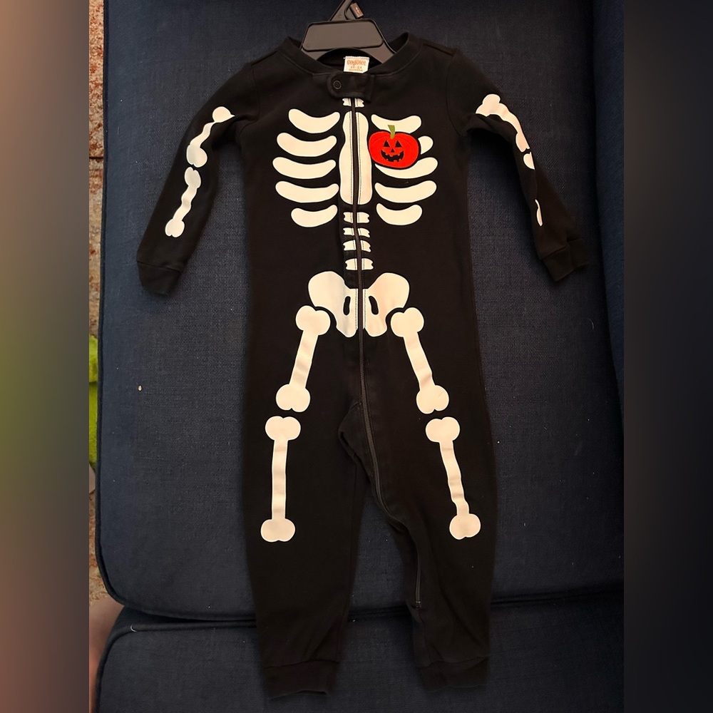 Black Skeleton Onesie with White Bones and Pumpkin